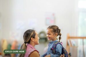 Educator smiling with a young child wearing a backpack, from the Child Care Now article, with a Child Care Now source label