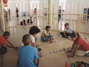 School-age children collaborating on a group building project